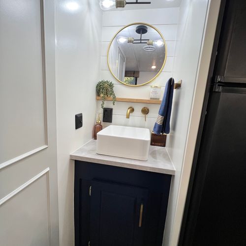 Replaced bathroom countertop, sink, faucet & mirror